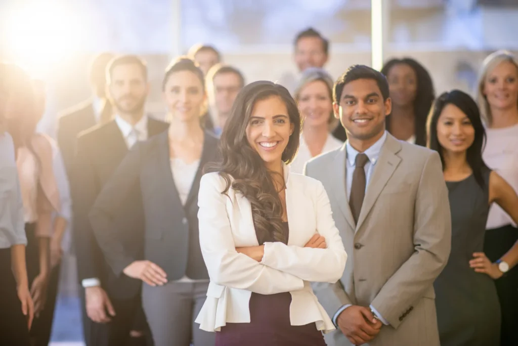 A diverse team of colleagues smiling together in a bright office